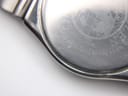 Close-up of the Citizen watch case back, showing 'CITIZEN WATCH CO. WATER RESIST JAPAN' engraving.