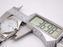 Close-up shot of a digital caliper measuring the watch case, displaying a diameter of 36.98mm.