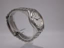 Angled side view of the Citizen watch on a display stand, highlighting the stainless steel bracelet and case profile.