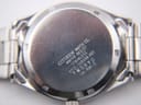 Close-up of the stainless steel case back of the Citizen watch, displaying "CITIZEN WATCH CO. WATER RESIST STAINLESS 6110-S64894 HST 7W9970 GN-4W-S" engravings.