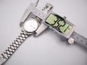 The Citizen watch being measured by a digital caliper, showing a case diameter of 35.2mm.