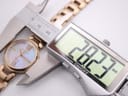 A digital caliper measuring the case diameter of the Citizen Eco-Drive watch, displaying 28.3mm.