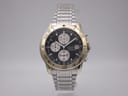 Front view of Citizen 0510-H03825 two-tone chronograph watch with black dial and steel bracelet.