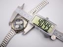 Digital caliper measuring the case diameter of the Citizen watch, showing 40.49mm on the display.