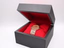 The Citizen watch presented in its open original black box with a red velvet interior.