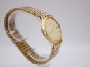 Another angled view of the Citizen quartz watch, highlighting the polished gold tone case and multi-link bracelet.
