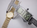 Digital caliper measuring the case diameter of the Citizen watch, displaying 33.15mm.