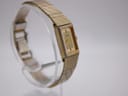 Another angled side view of the Citizen watch from a different perspective, highlighting the rectangular case and integrated bracelet.
