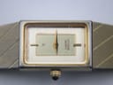 Close-up front view of the Citizen watch dial, showing the champagne face, gold hands, and "CITIZEN QUARTZ" text.