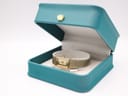The Citizen watch displayed inside its original teal-coloured box with a gold crown emblem on the lid.