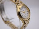 Close-up side view of the Citizen watch, highlighting some wear on the gold-tone case near the lugs.