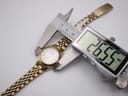 Top-down view of the Citizen watch, with a digital caliper measuring the case diameter at 26.55mm.