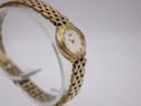 Side-on view of the gold tone Citizen ladies watch, highlighting the iridescent mother of pearl dial.