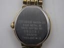 Close-up of the watch case back, showing 'CITIZEN WATCH CO. BASE METAL M 5920-H07782 RC 660081 EK2273 THAILAND -> 12' engravings.