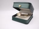 The gold tone Citizen watch displayed inside its original dark green presentation box with a crown emblem.