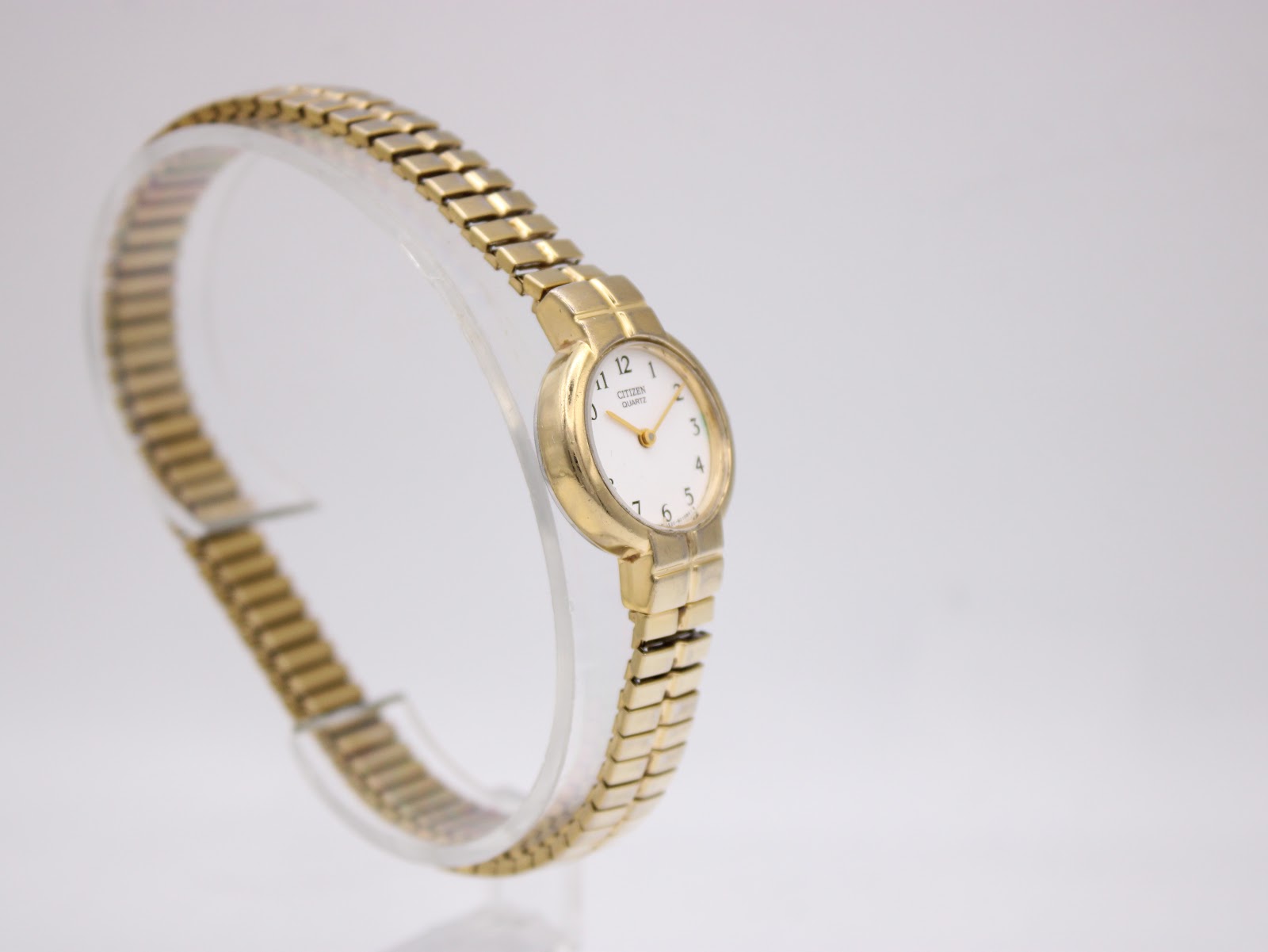 Another angled view from the left side of the gold tone Citizen ladies' watch, highlighting its design.