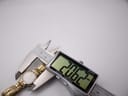 Close-up view of a digital caliper measuring the case diameter of the Citizen watch, displaying 20.62mm.