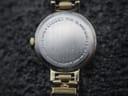 Detailed close-up of the brushed stainless steel case back of the Citizen watch, showing 'CITIZEN WATCH CO. WATER RESIST BASE METAL N 3005990 300190 BSM MOV'T JAPAN'.