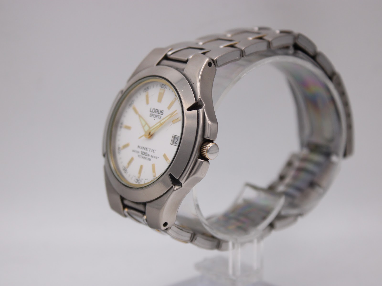 Angled side view of the Lorus Sports Kinetic watch, showcasing the profile of the titanium case and integrated bracelet.