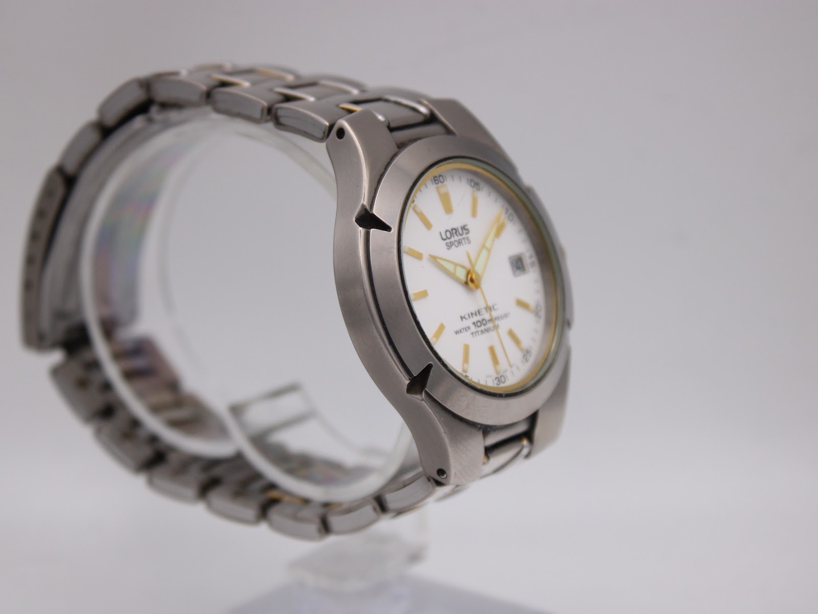 Another angled side view of the Lorus Sports Kinetic watch, highlighting the unique case shape and bracelet links.