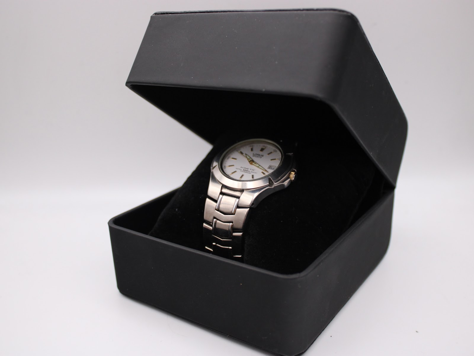 The Lorus Sports Kinetic watch nestled inside its original black presentation box.