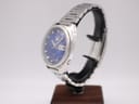 Angled side view of the Seiko 6119-8273 watch on a stand, highlighting the tonneau case shape and crown details.