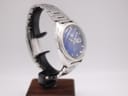 Another angled side view of the Seiko 6119-8273 on a stand, showing the integrated stainless steel bracelet.