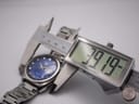 Digital caliper measuring the watch case, showing an exact diameter of 39.19mm.