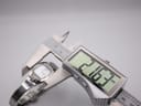 Digital caliper measuring the case diameter of the Tissot L953 watch at 21.67mm.