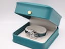 The Tissot L953 watch presented in its original teal-coloured box.