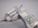 Digital caliper measuring the case diameter of the Gucci 1900 L, displaying 23.87mm.