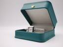 The Gucci 1900 L watch presented in its original teal-coloured Gucci box with a gold crown logo.