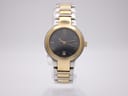 Front view of the Gucci 8900L watch with a two-tone case, black dial, and gold-tone indices.