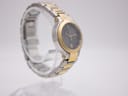Another angled side view of the Gucci 8900L watch, highlighting the bracelet's two-tone design.