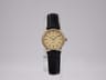 Vintage Tissot ladies' quartz watch, 21.1mm gold tone case, elegant champagne dial, black leather strap, 1980s Swiss classic