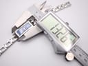 Digital caliper measuring the case width of the Gucci 110 watch, displaying 13.26mm.