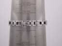 The integrated stainless steel bracelet of the Gucci 110 watch on a wrist sizing cone, showing a circumference of approximately 172mm.