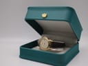 Citizen Eco-Drive watch displayed inside a teal coloured gift box with a gold crown emblem.