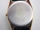Close-up of the brushed stainless steel case back, showing the model number 7812-5109, serial number 900087, and material markings.
