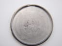 Close-up of the inner side of the stainless steel case back, engraved with 'Japan F Seiko Time Corp.'.