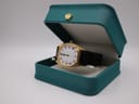 The Seiko watch presented inside a teal-coloured decorative display box with a crown emblem on the lid.
