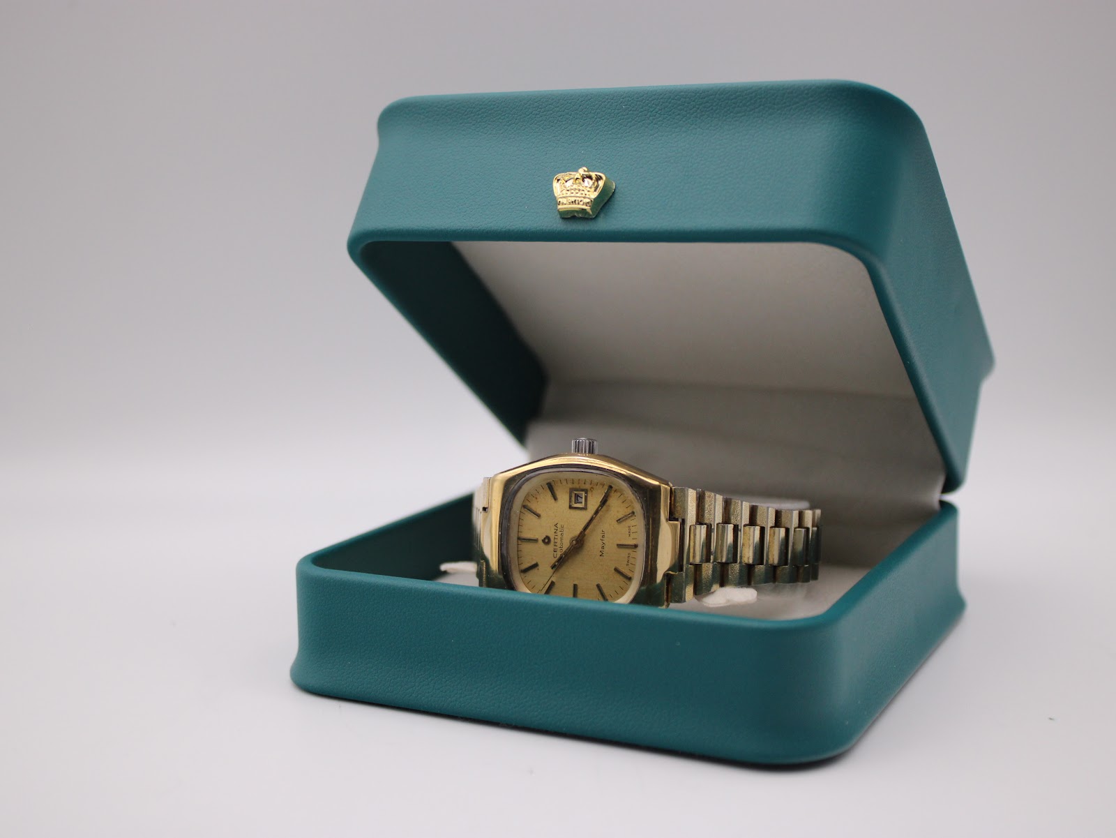 The Certina Mayfair watch presented in a generic green watch display box.