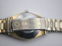 Close-up of the Certina signed fold-over clasp on the gold-plated steel bracelet.