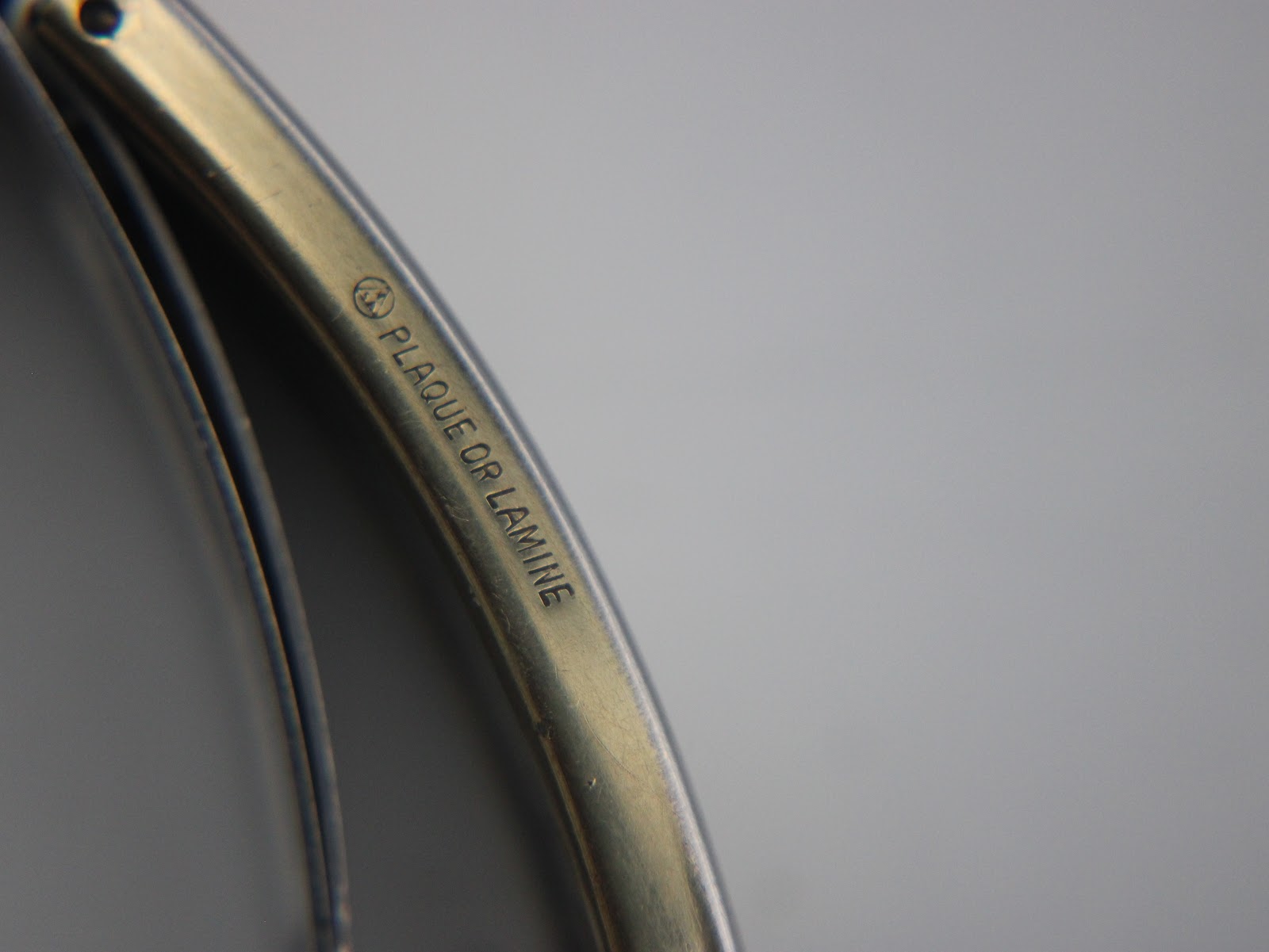 Detailed view of the inside of the bracelet clasp, confirming "PLAQUE OR LAMINE" (gold plated/laminated).