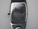 Close-up of the Tissot G345 case back, showing engravings for Tissot, 1853, water resistance, sapphire crystal, stainless steel, model G345, and serial SKO-BC-24384.