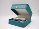 The Tissot G345 watch displayed inside an open turquoise presentation box, providing context for size.