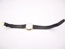 Back view of the Raymond Weil watch with strap laid flat, showing 'GENUINE LEATHER SWISS MADE' on strap.