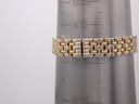 The watch's gold-plated link bracelet on a wrist sizing gauge, indicating a maximum wrist circumference of 172mm / 17.2cm.