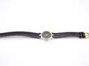 Full length view of the Gucci 3400 L watch with its black textured leather strap extended.