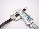Digital caliper measuring the case diameter of the Gucci 3400 L watch, showing 21.90mm.